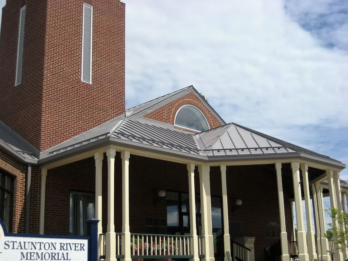 Skilled roofing craftsmen working on a residential roof in Saraland